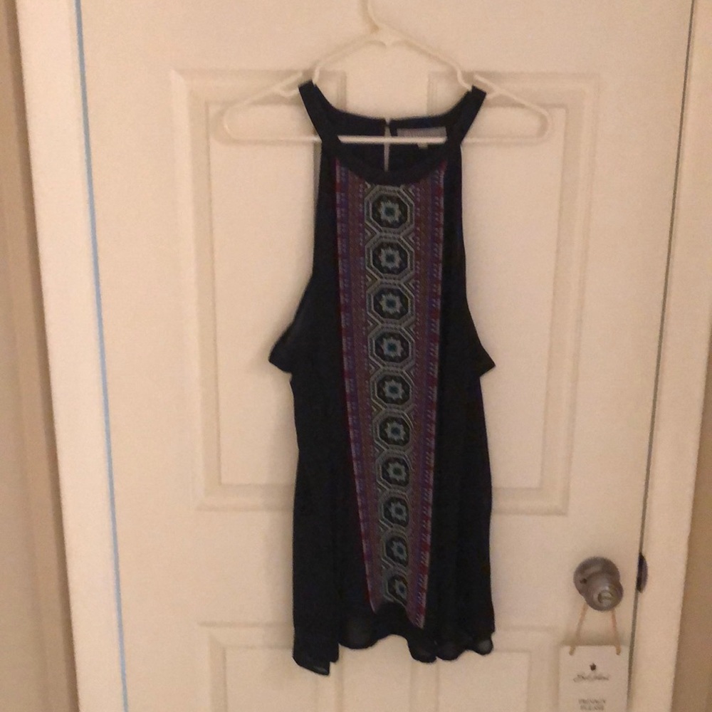 Ladies halter top with decorative panel down center front. 2 layers of material.